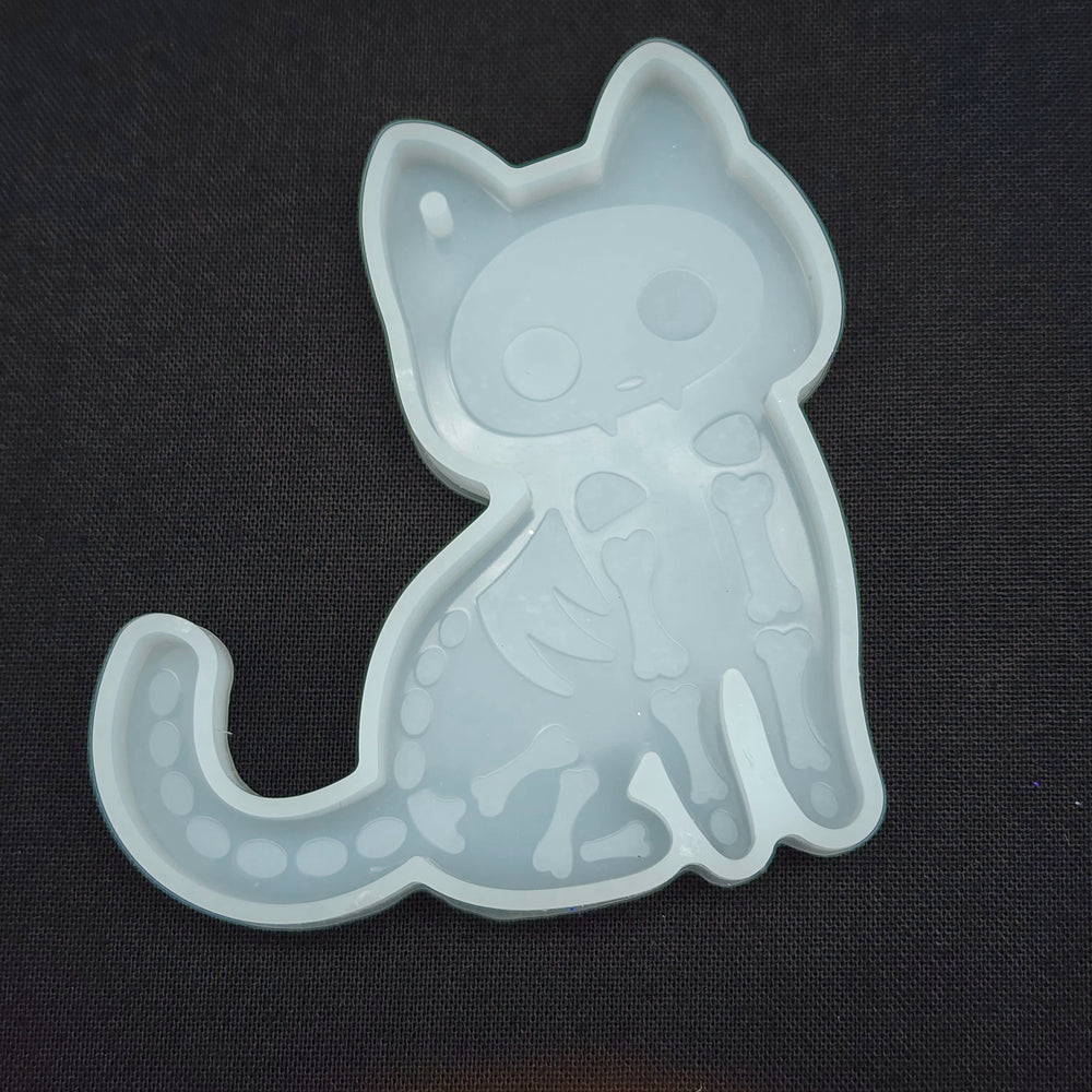
            
                Load image into Gallery viewer, The Cute But Creepy Collection - Sitting Skeleton Cat Keychain Mold
            
        