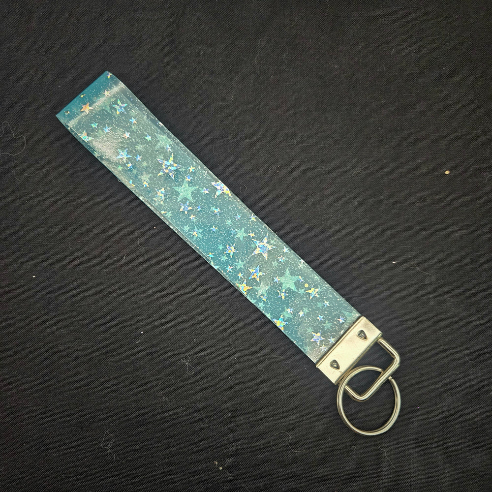 
            
                Load image into Gallery viewer, Holographic Star Wristlet Keychain - Blue
            
        