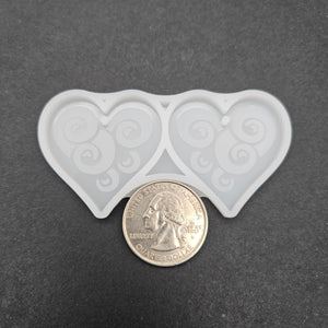 
            
                Load image into Gallery viewer, Swirly Heart Earring Mold
            
        